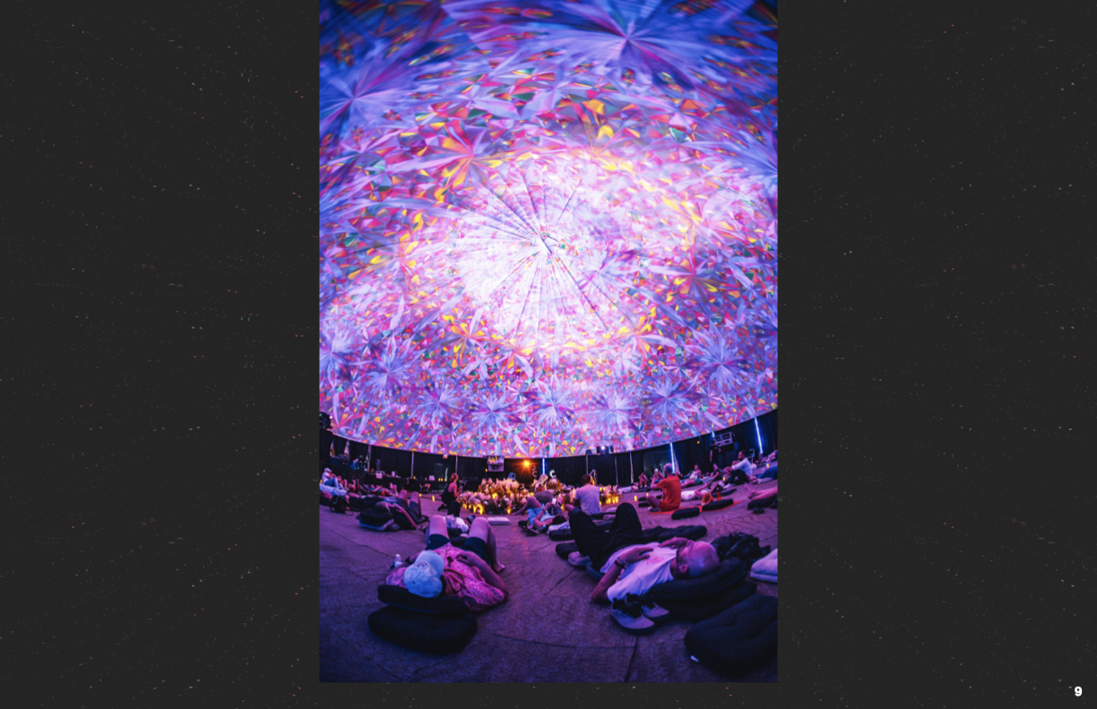 Dome ceremony with pink and yellow kaleidoscope projection
